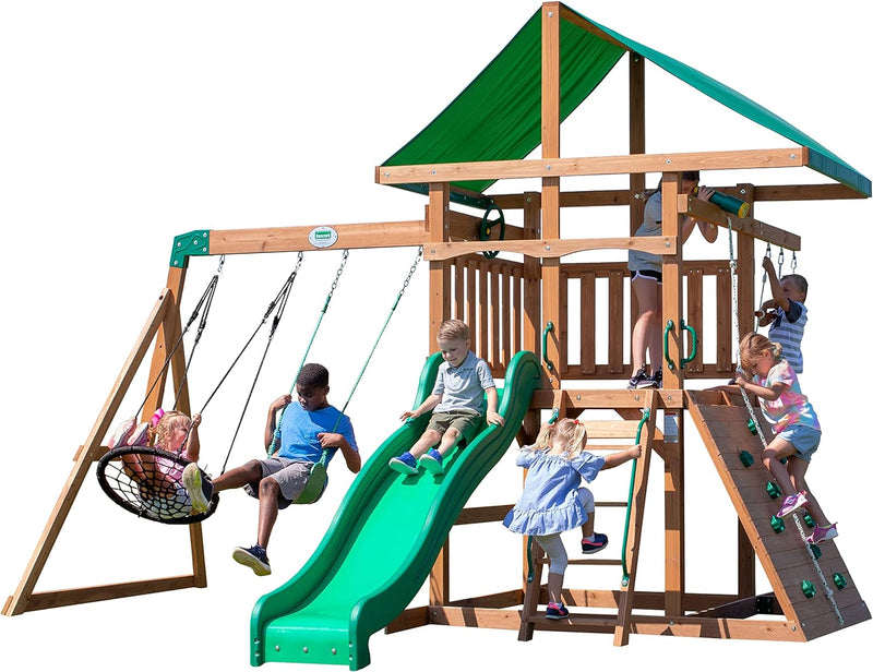 A complete set of wooden mountain-style swings, equipped with a colorful canvas sunshade, a wave slide, a rope swing, a net swing, and a rock wall with climbing ropes and ladders. E6